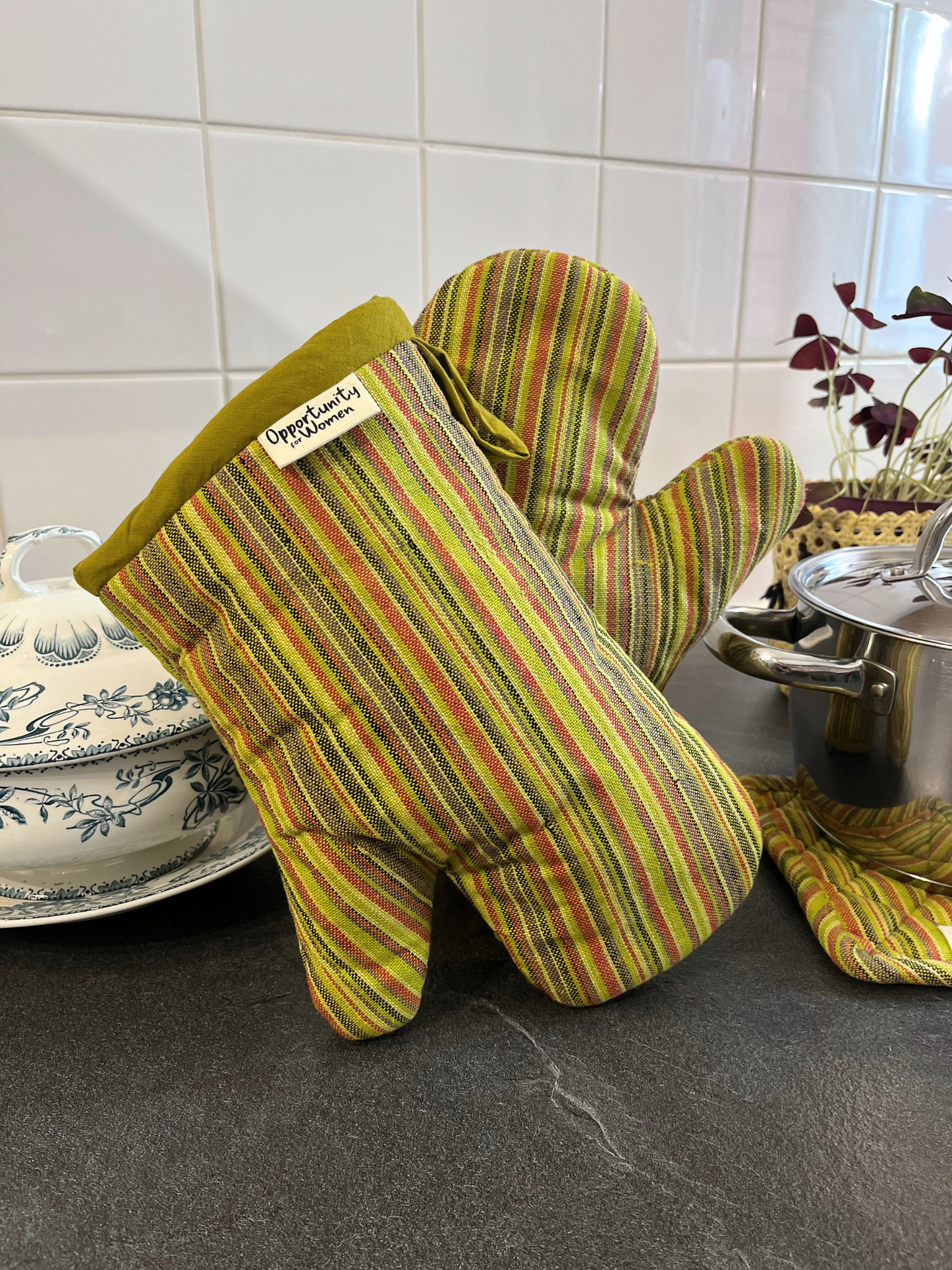 Green oven mitts with multicolored stripes