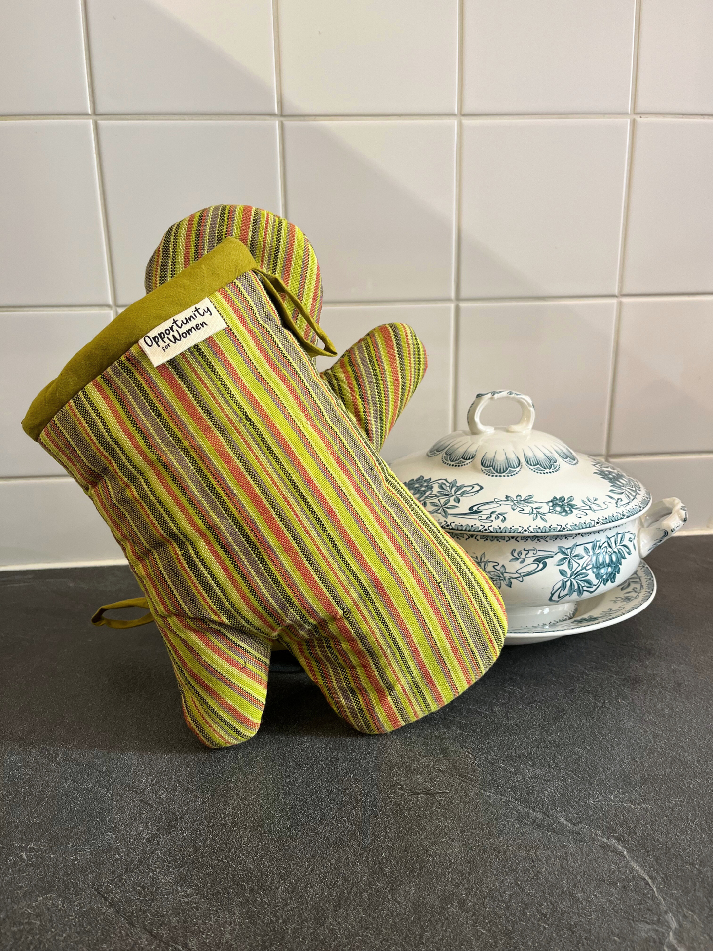 Green oven mitts with multicolored stripes